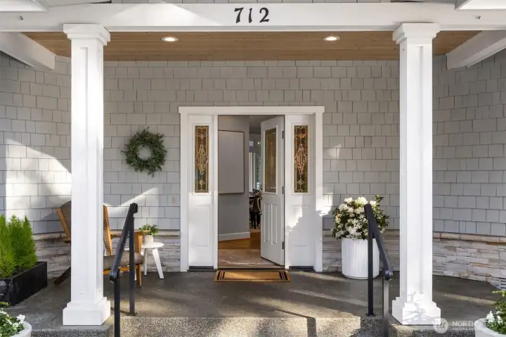 A covered front porch welcomes you home and greets your guests.