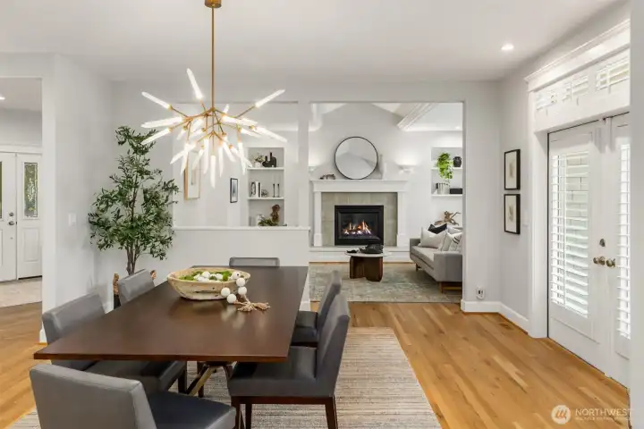 The dining area with a fabulous centerpiece Visual Comfort light fixture.