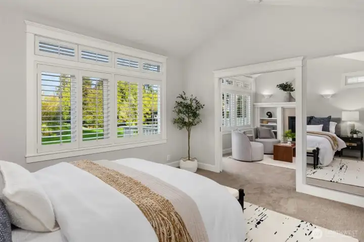 The nicely sized primary suite has a private sitting area adjacent to the bedroom. It also has a large walk-in closet.