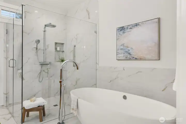 The soaking tub and oversized shower.