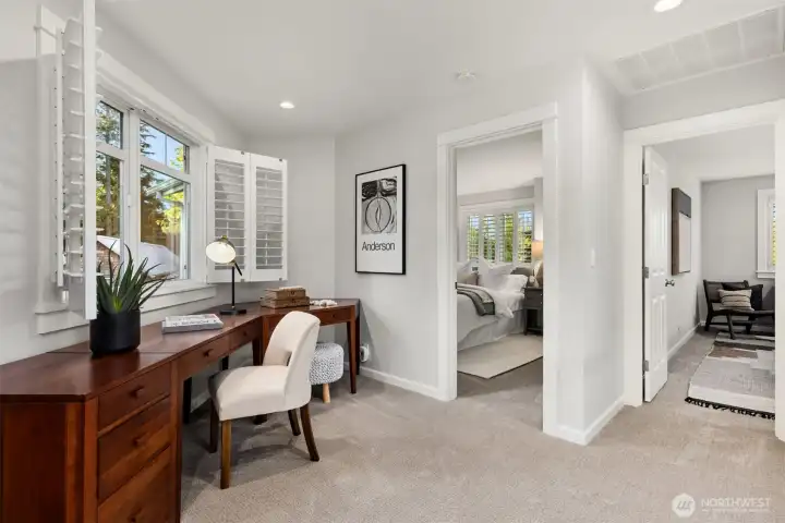 Moving upstairs to the office loft plus the two additional bedrooms. The office loft is the perfect spot to get some work done while you check out the action and views of the golf course.