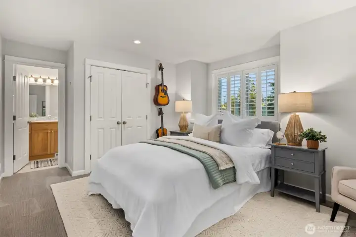 The ensuite bedroom upstairs has its own private attached bathroom and views out to the course.