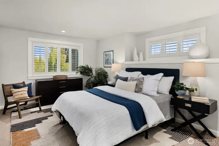 The second bedroom upstairs. Both bedrooms are gerously sized and have lovely golf course vistas.
