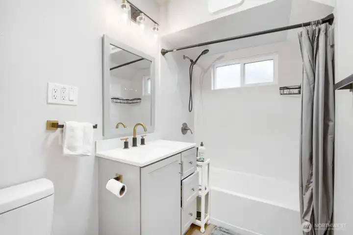 Updated bathroom with white cabinets