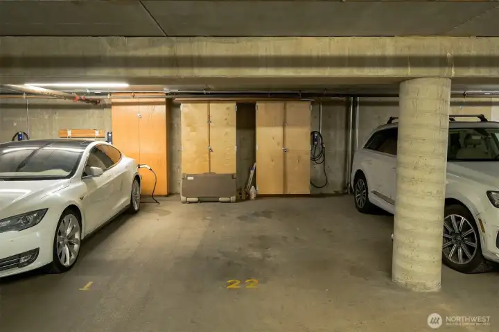 There are two secure garage spaces in the underground garage, both with individual EV chargers, plus a private storage unit and extra storage cabinets.
