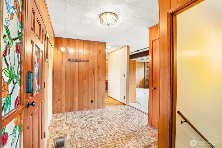 Coat closet to left of door.  Door to basement on right.