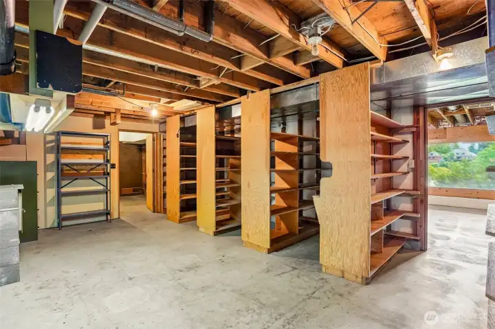 Unfinished basement storage room - tons of shelves.