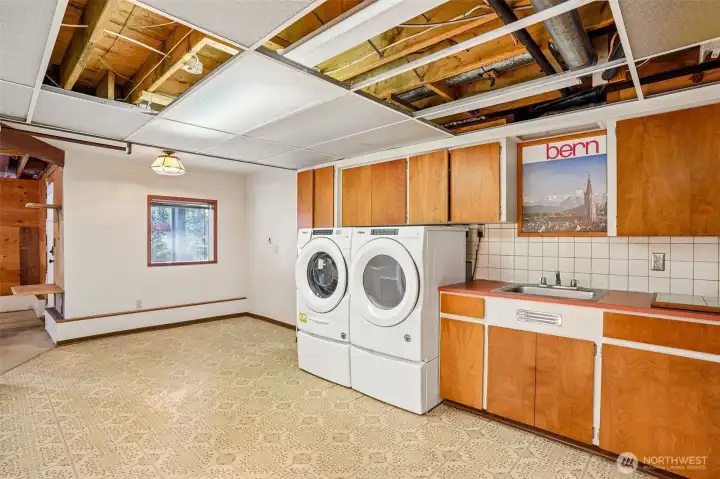Basement partial kitchen/laundry room.