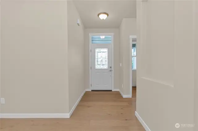 Welcoming and spacious entry way with hardwood flooring. Picture of a similar home, not actual. Photo for illustration only.