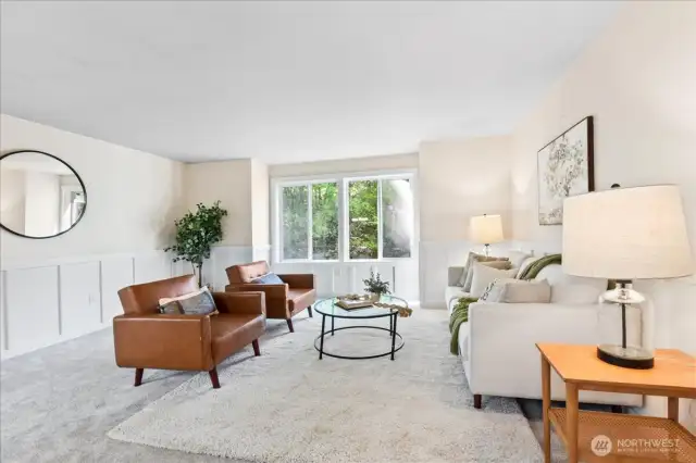 Formal Living Room just off the entry.  Beautiful wainscot and brand-new carpet.