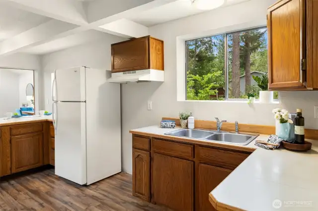 Kitchen with Wood Cabinets - Range is Provided but Not Pictured