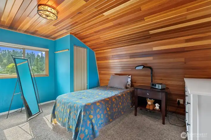 Sleeping loft with closet.