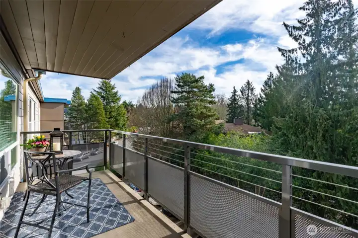 Deck overlooks peaceful greenbelt