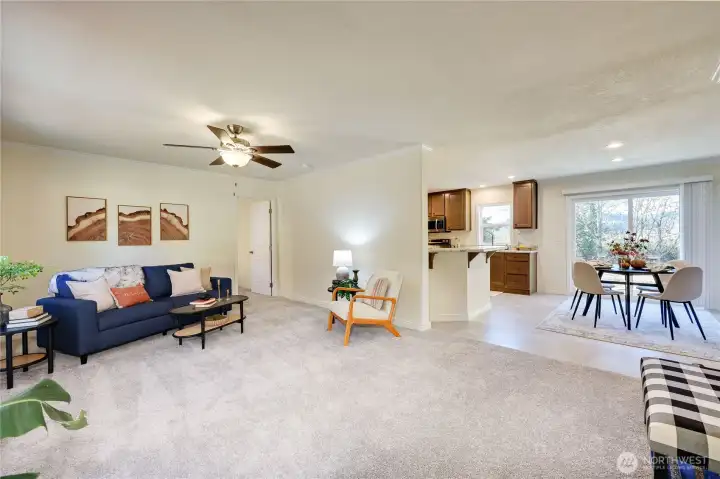 Open concept from the living room, dining area and kitchen. Slider from the dining area to spacious back patio.