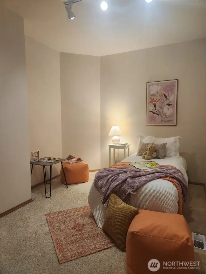 Secondary bedroom on main with morning light.