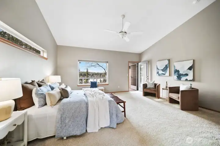 Sizeable primary boasts the endless view and deck access.