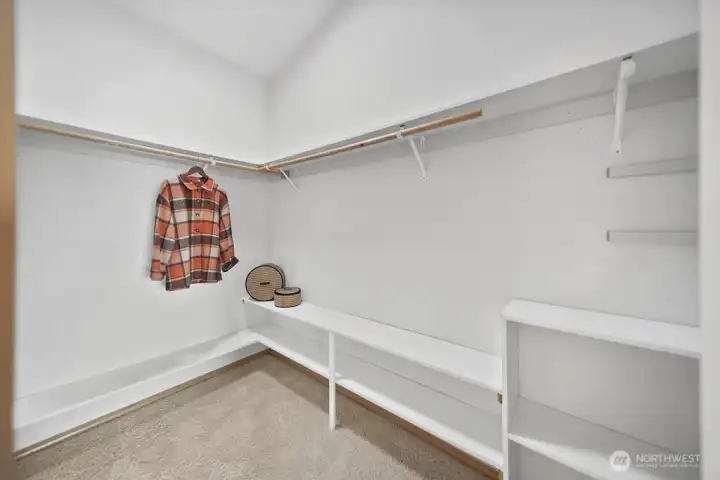Walk in closet  in primary bedroom.