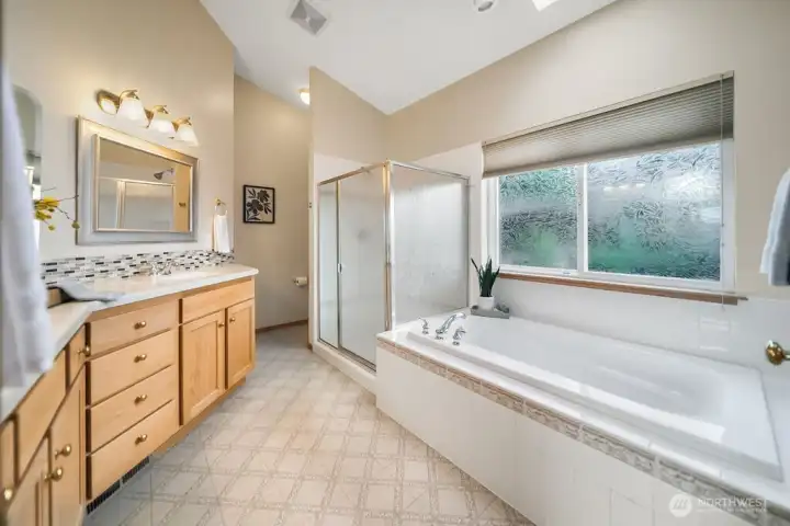 Primary ensuite with double vanity and generous storage.