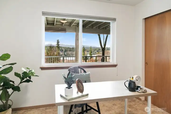 Lower level bedroom 3 currently staged as an office space.