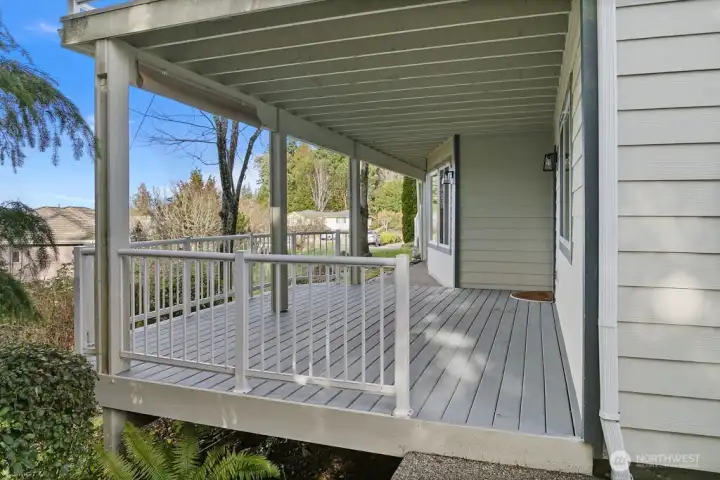 Dry  covered lower level deck thoughtfully protected by solid membrane deck above.