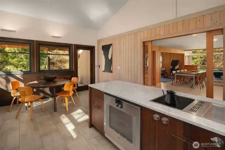 A curated, integrated suite of appliances by Miele and Gaggenau pair well with the oversized Sub-Zero refrigerator.