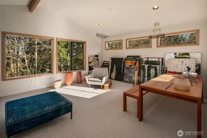 Upstairs the loft area is versatile, airy.