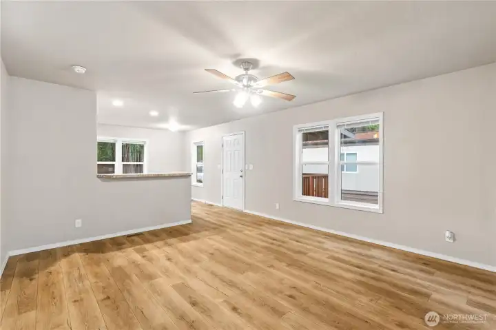Open living area with large windows providing abundant natural light.