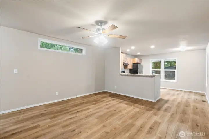 Open living space with comfortable layout connecting to the kitchen.