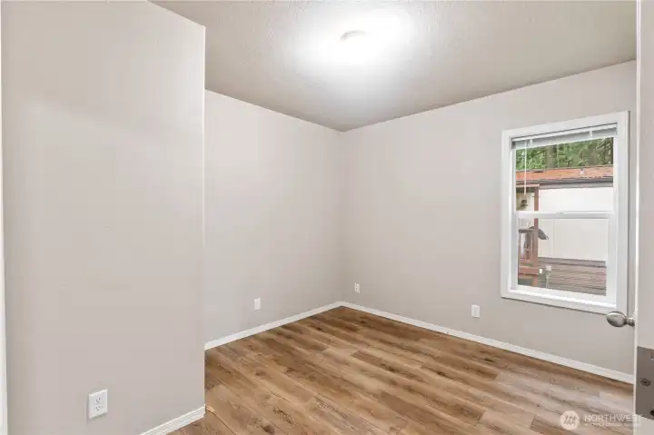 Second bedroom located off the main living area, ideal for guests or office space.