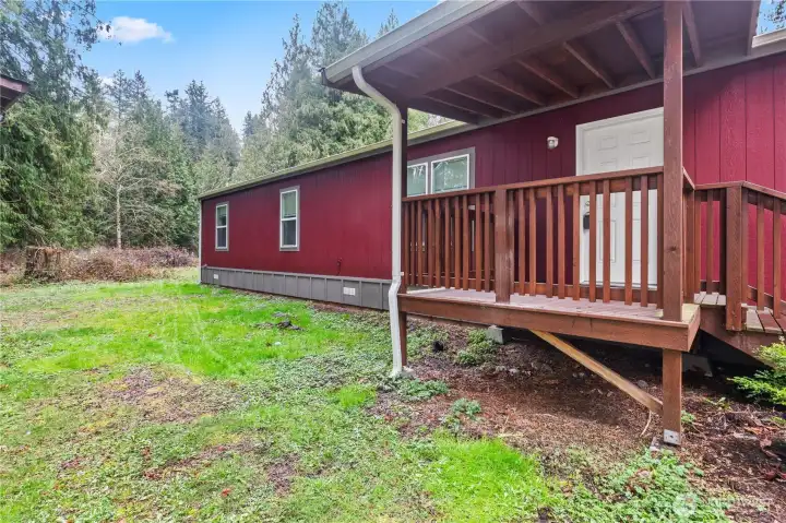 Side view of home showing lot space and outdoor area.