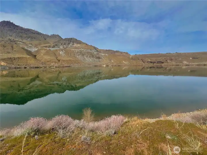 Experience refined riverfront living at 119 N Shore Dr in desirable Beebe Ranch community