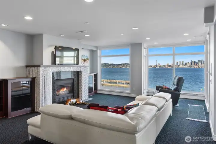 Floor-to-ceiling windows span the entire front of this fifth-floor residence, framing sweeping views of the Space Needle—perfect for taking in dazzling Fourth of July fireworks and the nightly glow as downtown Seattle comes alive. Designed for both effortless entertaining and comfortable everyday living, this exceptional home offers the space and feel of a single-family residence, all within the convenience of a luxury condominium.