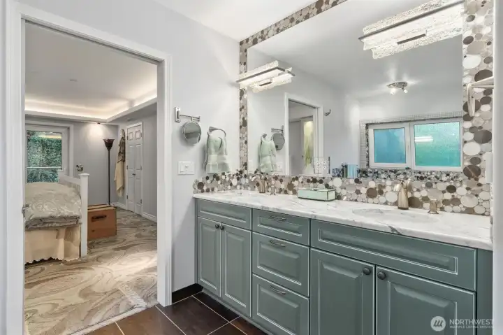 One final view of the updated primary bath highlights dual sinks and thoughtfully selected spa-inspired finishes, creating a calm, refined, and luxurious atmosphere.