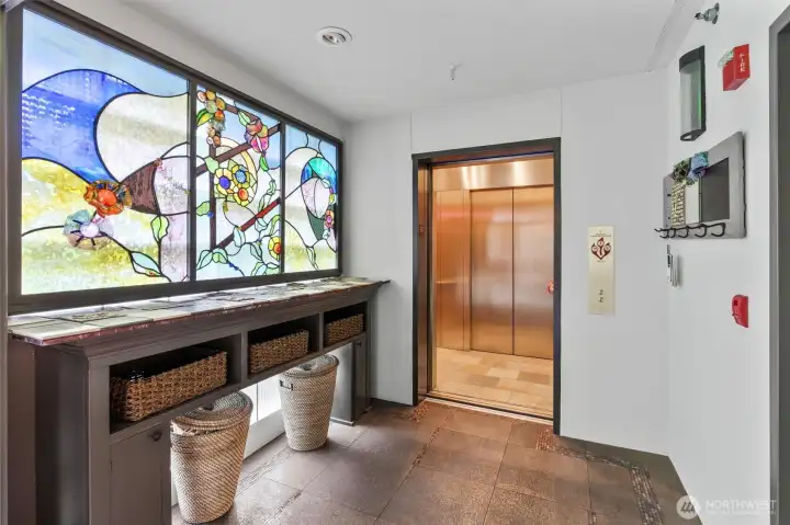 The keyed, secure elevator opens directly into your own private foyer, offering a seamless and private arrival experience. This welcoming entry space provides a convenient place to hang coats or set down packages before stepping into the home. An added benefit of ownership here is that the elevator has already been fully modernized, ensuring both comfort and peace of mind.