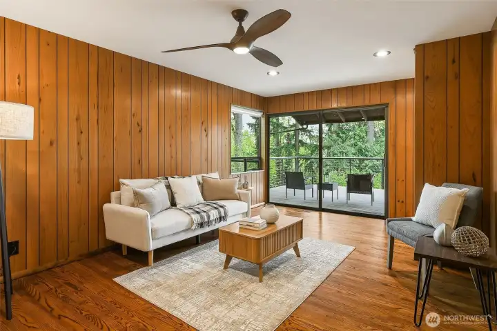 Family Room with Deck access. The Kitchen is off to the right, out of view