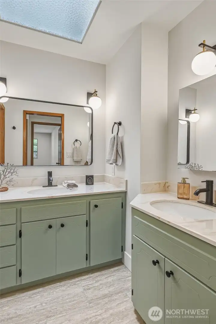 Refreshed Upstairs Guest Bath with 2 Vanities and a Skylight