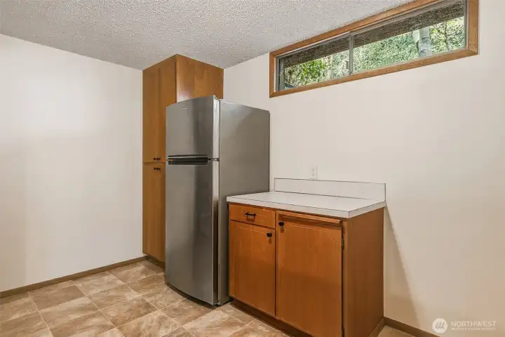 Potential Kitchen has a refrigerator, stove, and plumbing. Buyer to Verify