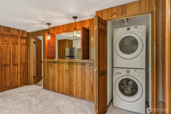 Closet is plumbed for a stackable washer/dryer  Virtually Staged