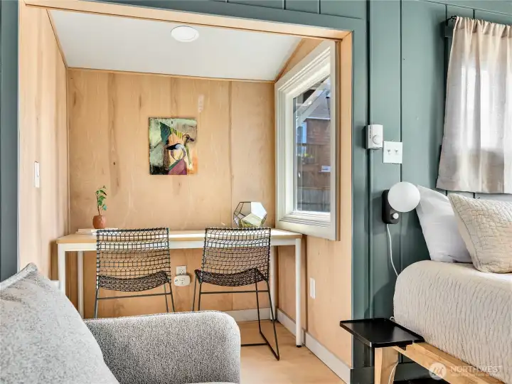 Cozy little nook doubles as dining table and work space. Cozy little nook doubles as dining table and work space.