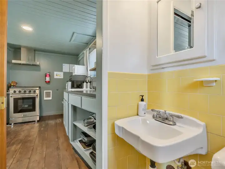 Timeless porcelain sink reminds you this is still a classic beach bungalow. Timeless porcelain sink reminds you this is still a classic beach bungalow.