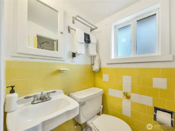 Light & bright bathroom complete with cheery yellow tile! Light & bright bathroom complete with cheery yellow tile!