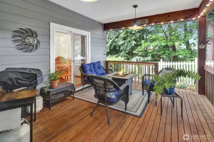 Another great view of this private covered deck amidst the tall green trees !