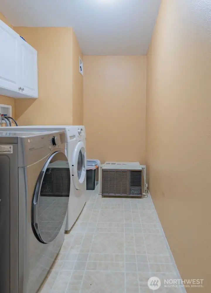 Utility Room, Washer & Dryer & the window AC unit stays. Utility Room, Washer & Dryer & the window AC unit stays.