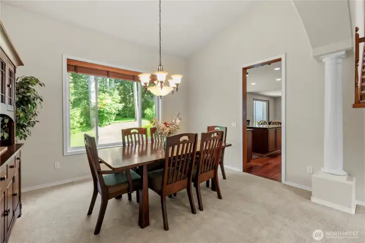 Gather friends around the dining table, with easy access to the kitchen.
