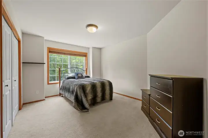 Secondary bedroom #1 has great  space and a big window.