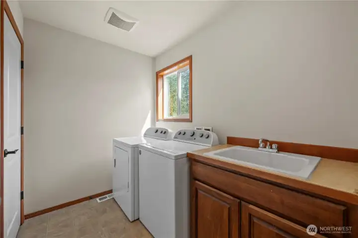 Ready for a laundry room that has storage AND the mud sink? You've got it all here.