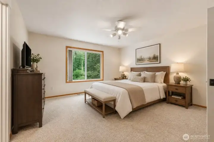 Escape to the spacious primary suite, a serene retreat designed for comfort and relaxation. Fresh interior paint, plush new carpeting with upgraded premium moisture-resistant memory foam-style padding, and peaceful woodland views create a warm and inviting atmosphere. The suite offers exceptional storage with both a generous walk-in closet and a second full-size closet, providing abundant space for clothing, accessories, and seasonal storage. The beautifully remodeled spa-inspired ensuite elevates everyday living with a luxurious freestanding soaking tub, an expansive walk-in ceramic tile shower with a sleek frameless glass enclosure, elegant quartz countertops, rich custom wood cabinetry, and designer oil-rubbed bronze Moen Belfield fixtures. Thoughtfully curated with timeless finishes and modern sophistication, this private sanctuary offers the perfect blend of luxury, comfort, and everyday indulgence. Escape to the spacious primary suite, a serene retreat designed for comfort and relaxation. Fresh interior paint, plush new carpeting with upgraded premium moisture-resistant memory foam-style padding, and peaceful woodland views create a warm and inviting atmosphere. The suite offers exceptional storage with both a generous walk-in closet and a second full-size closet, providing abundant space for clothing, accessories, and seasonal storage. The beautifully remodeled spa-inspired ensuite elevates everyday living with a luxurious freestanding soaking tub, an expansive walk-in ceramic tile shower with a sleek frameless glass enclosure, elegant quartz countertops, rich custom wood cabinetry, and designer oil-rubbed bronze Moen Belfield fixtures. Thoughtfully curated with timeless finishes and modern sophistication, this private sanctuary offers the perfect blend of luxury, comfort, and everyday indulgence.