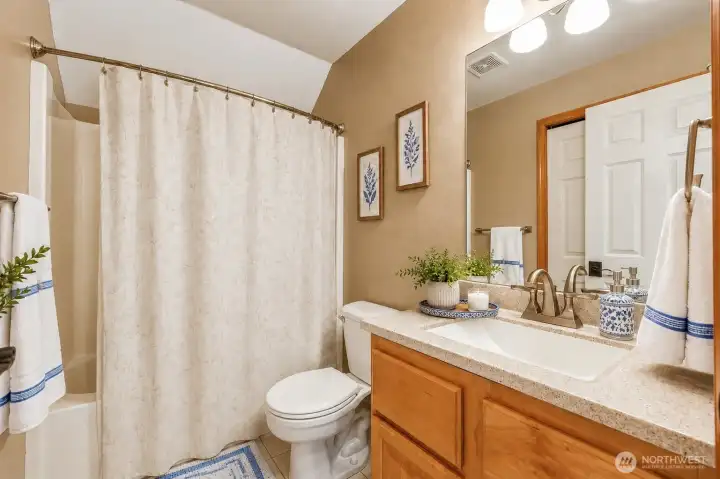 Serving the upstairs bedrooms, this beautifully maintained full bathroom combines timeless finishes with everyday convenience. Serving the upstairs bedrooms, this beautifully maintained full bathroom combines timeless finishes with everyday convenience.