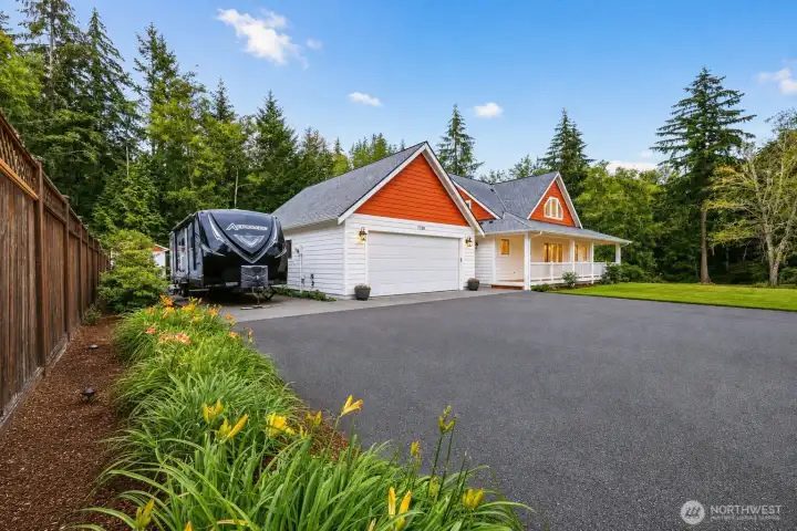 An impressive arrival begins with an expansive paved driveway offering parking for 8+ vehicles, dedicated RV parking, and an inviting covered front porch that welcomes you home. Surrounded by towering evergreens, colorful landscape beds, and a peaceful woodland setting, this beautifully maintained residence blends exceptional functionality with timeless Northwest elegance. From its striking architecture and warm cedar-style accents to the generous outdoor space, every detail reflects the privacy, comfort, and versatility that make this 2.26-acre property truly exceptional. An impressive arrival begins with an expansive paved driveway offering parking for 8+ vehicles, dedicated RV parking, and an inviting covered front porch that welcomes you home. Surrounded by towering evergreens, colorful landscape beds, and a peaceful woodland setting, this beautifully maintained residence blends exceptional functionality with timeless Northwest elegance. From its striking architecture and warm cedar-style accents to the generous outdoor space, every detail reflects the privacy, comfort, and versatility that make this 2.26-acre property truly exceptional.