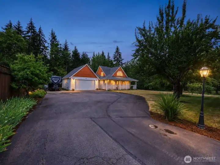 Imagine arriving home each evening to this picture-perfect Northwest retreat. Warm light spills from the windows, the welcoming wraparound porch invites you to slow down, and the expansive driveway with dedicated RV parking offers exceptional convenience. Nestled among towering evergreens on 2.26 private acres, this remarkable property feels like a destination you'll never want to leave. Imagine arriving home each evening to this picture-perfect Northwest retreat. Warm light spills from the windows, the welcoming wraparound porch invites you to slow down, and the expansive driveway with dedicated RV parking offers exceptional convenience. Nestled among towering evergreens on 2.26 private acres, this remarkable property feels like a destination you'll never want to leave.
